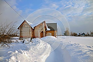 Russian log house in winter. Village Visim, Ural region, Russia