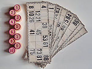 Russian lotto, bingo board game, barrels and cards on a white background. Quarantine Games Concept. Board game lotto with wooden