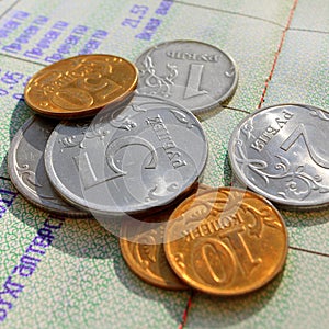 Russian metal coins against the background of a passbook