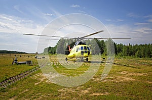 Russian Mi-8 passenger helicopter parked at the rural airfield in Siberia