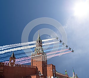 Russian military aircrafts fly in formation over MoscowSpassky Tower of Moscow Kremlin during Victory Day parade, Russia