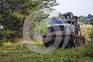 Russian military engineering crawler excavator in forest photo