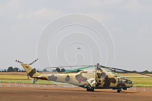 Russian Military Gunship Helicopter Parked At Airfield photo