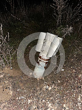 Russian MLRS Grad projectile in the ground on liberated from occupation territory of Ukraine photo