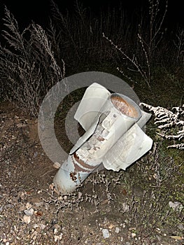 Russian MLRS Grad projectile in the ground on liberated from occupation territory of Ukraine photo