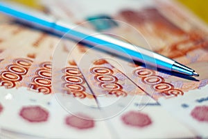 Russian money and pen