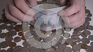Russian money rubbles and coins over white table Hands count money slow motion hd footage abstract