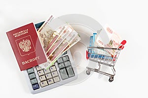 Russian money in Shopping Cart and russian passport. Banknotes of Russian rubles. Cash, currrency, banknotes bank Russia