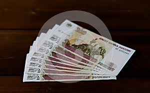 Russian money on a wooden background