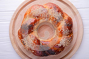 Russian national bread Kalach on a white wooden background