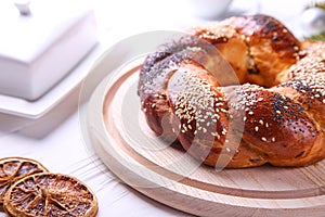 Russian national bread Kalach on a white wooden background