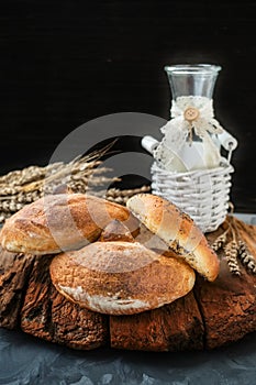 Russian national bread Kalach on a wooden background. National bread products