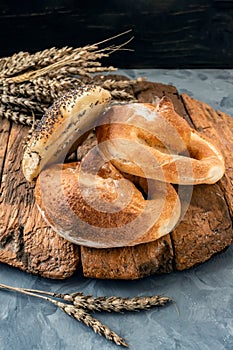 Russian national bread Kalach on a wooden background. National bread products