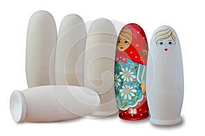 Russian nesting dolls. Painted and unpainted. Isolated on white