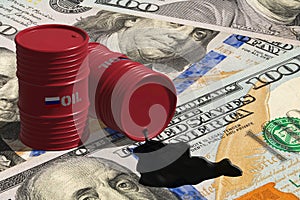 Russian Oil spilling from oil barrels on US dollars photo