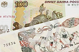A Russian one hundred ruble note paired with a beige 200 Algerian dinar bank note.