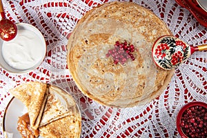 Russian pancake blini with berries and sour cream