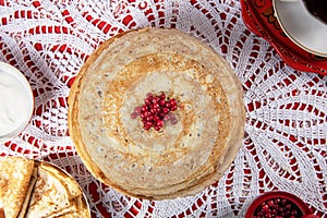 Russian pancake blini with berries and sour cream