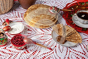 Russian pancake blini with berries and sour cream