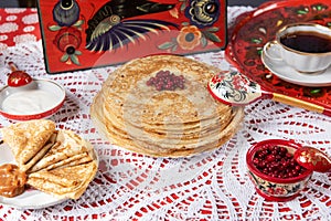 Russian pancake blini with berries and sour cream