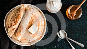 Russian pancakes blini on black with copy space