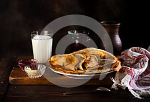 Russian pancakes crepes with butter and raspberry jam