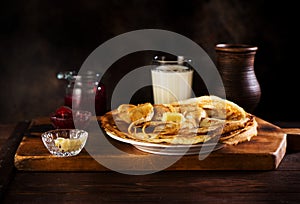 Russian pancakes crepes with butter and raspberry jam