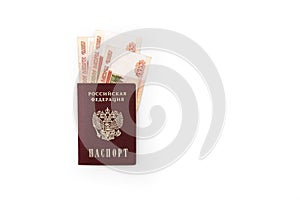 Russian passport with banknotes of 5000 rubles on a white background