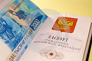 Russian passport and blue banknote