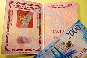 Russian passport and blue banknote