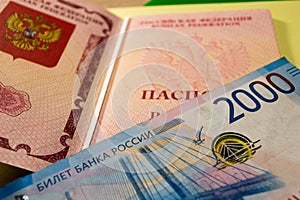 Russian passport and blue banknote