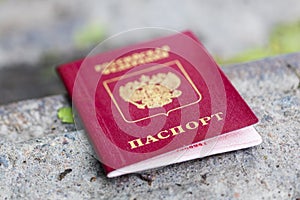 A Russian passport is on a kerb in the city. Lost document