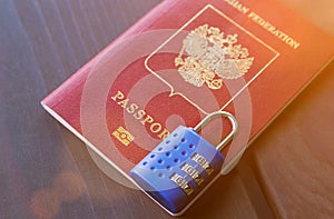 Russian passport locked to padlock. Symbol of anti-Russian sanctions photo