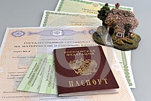 Russian passport with model of house and maternal, birth and pen