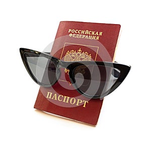 Russian passport and sunglasses isolated on white background. Close-up photo. Travel concept.