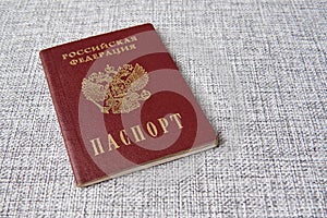 Russian passport on a textured background. Russian Federation and Passport is written in Russian.