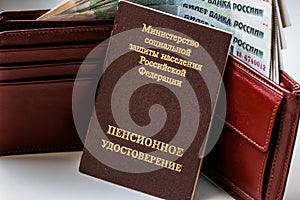 Russian pension certificate and wallet with russian rubles.