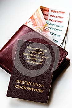 Russian pension certificate and wallet with russian rubles.