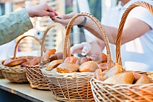 Russian pirozhki, baked patties or pies in basket for sale