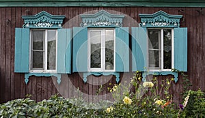 Russian Red Log Cabin with Flowers