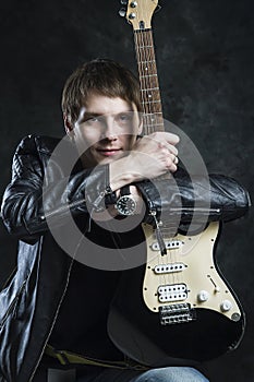 Russian Rocker. The guy with the guitar in front of a photographer. Grunge music, strings, music, instrument, guitar, spirituality