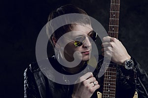 Russian Rocker. The guy with the guitar in front of a photographer. Grunge music, strings, music, instrument, guitar, spirituality