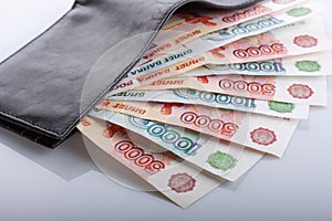 Russian rouble bills in black leather wallet photo