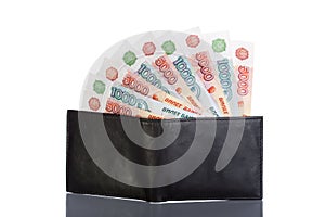 Russian rouble bills in black leather wallet photo