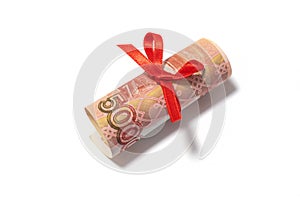 Russian roubles with red bow isolated on the white background