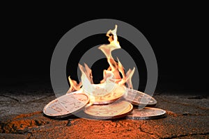 Russian Ruble coins burning on black background. Concept loss of value and inflation. 3d render