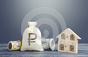 Russian ruble money bag and puzzle house. Mortgage loans building maintenance and utility services costs. Housing cooperative