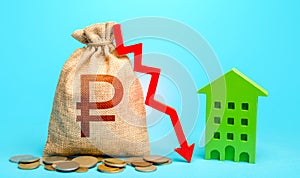 Russian ruble money bag with red arrow down and green house. Profitability of using green eco technologies in construction of