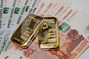 Russian rubles banknotes with gold bullion bars