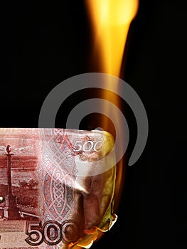 Russian rubles bills on fire